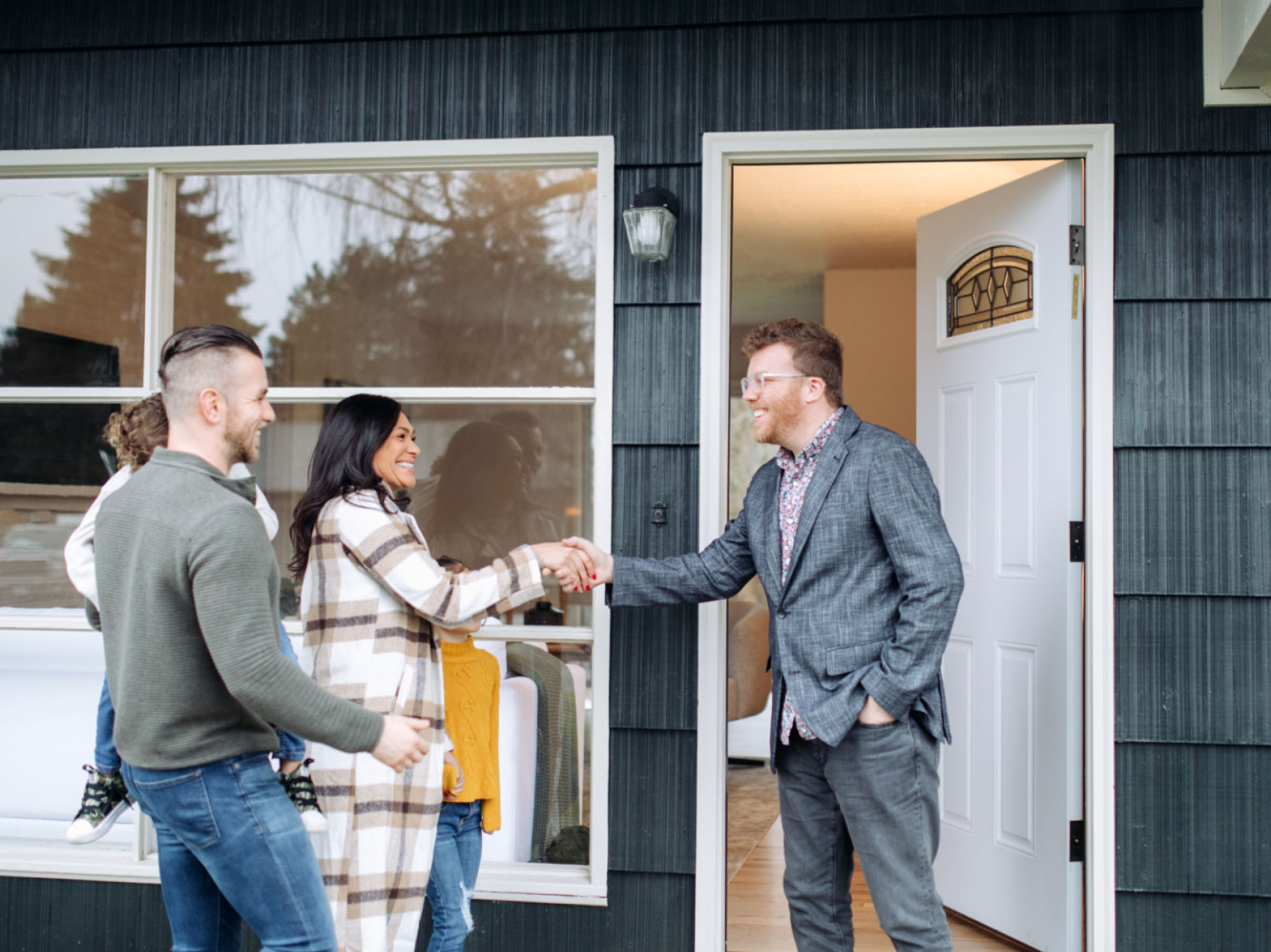 Couple visiting new home entrance