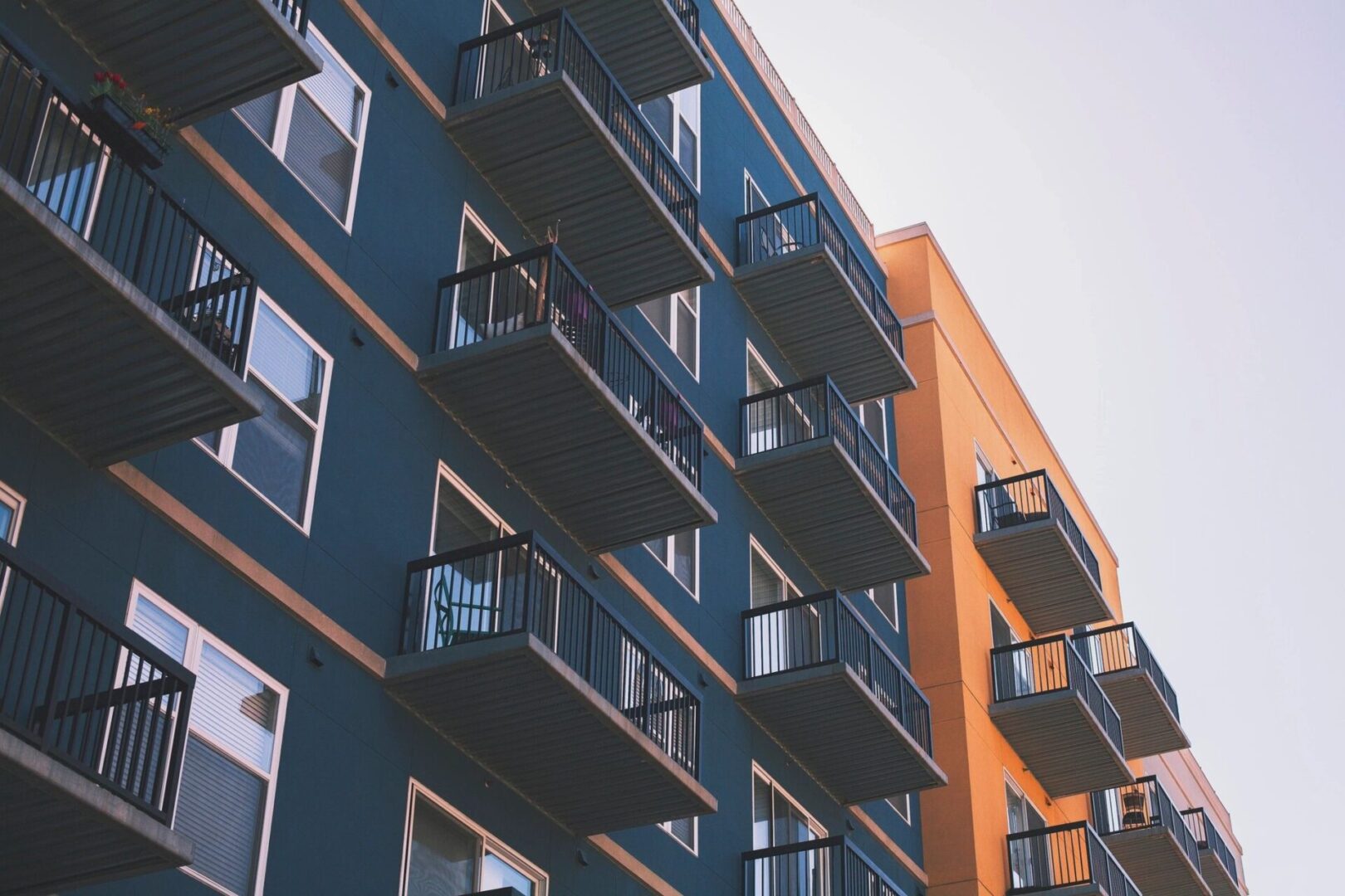 Blue and orange apartment building with balconies