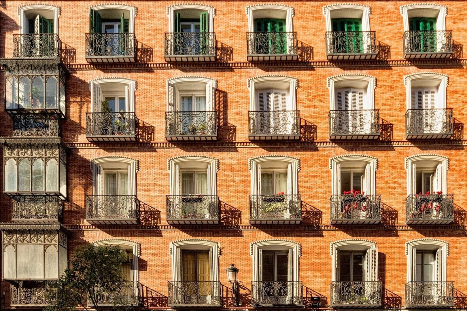 Brick building with ornate balconies